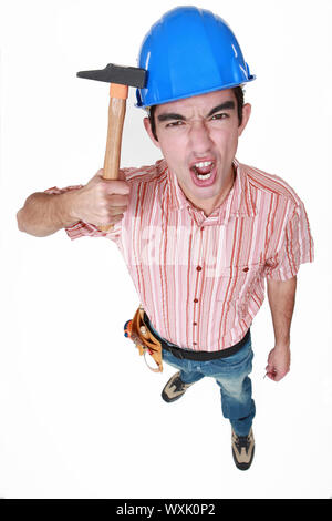 Bauarbeiter mit dem Hammer auf den Kopf Stockfoto