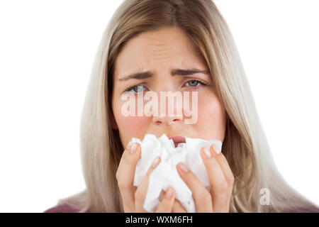 Müde Frau mit einer Grippe und Taschentuch Stockfoto