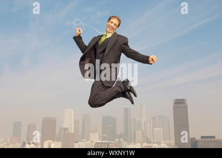 Geschäftsmann mit MP3-Player Stockfoto