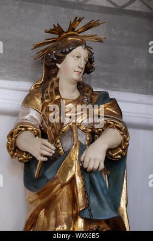 Saint Juliana, Altar Statue in der Kirche St. Agatha in Schmerlenbach, Deutschland Stockfoto