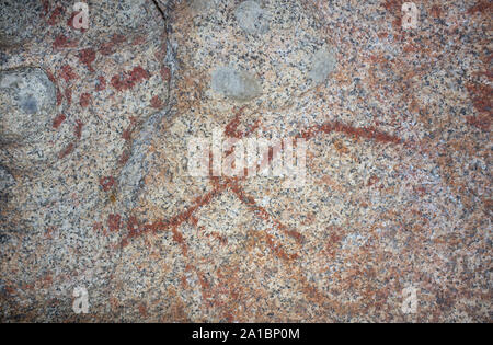 Esquema prehistórico pinturas dentro de bloques de granito en el Monumento Natural de Los Barruecos, Extremadura, España. Rama con forma de pintura que retrata a un ho