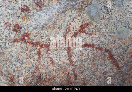 Esquema prehistórico pinturas dentro de bloques de granito en el Monumento Natural de Los Barruecos, Extremadura, España. Rama con forma de pintura que retrata a un ho