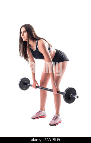 Mujer en ropa deportiva. Mujer realizando ejercicios con barbell en el  gimnasio Fotografía de stock - Alamy