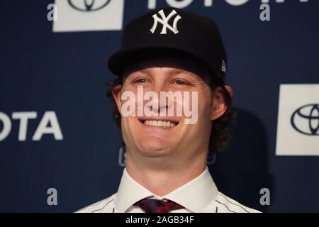 Bronx, United States. 18th Dec, 2019. Manager Aaron Boone with Gerrit Cole  and his wife Amy Cole as the New York Yankees hold a press conference  introducing their new $324 million pitcher