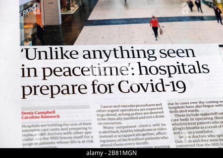 Titular del periódico de la página "a diferencia de cualquier cosa vista en tiempos de paz: Los hospitales se preparan para Covid-19" el 14 de marzo de 2020 en Londres, Inglaterra, Reino Unido Foto de stock