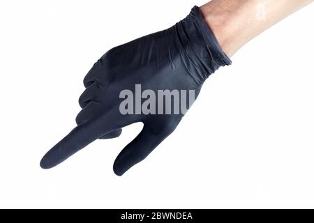 Mano en un guante de látex protector médico negro que señala el gesto aislado en blanco, cortado. Mano humana en la interacción de la interfaz del guante de goma, señalando Foto de stock