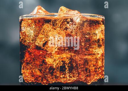 Glass Of Ice Cubes In Fizzy Drink by Walter Zerla