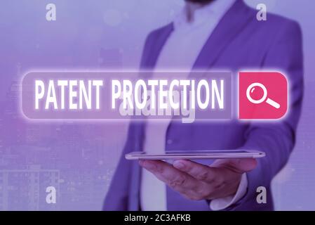 Texto a mano Protección de patentes. La fotografía conceptual proporciona a una persona o entidad legal derechos exclusivos Foto de stock