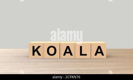 Koala - palabra cubos de madera en la mesa horizontal sobre fondo gris. Australia animal, emergencia australiana, ayuda fuego emblema diseño plantilla. Veterina Foto de stock