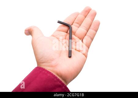 Una llave hexagonal negra en L sobre fondo blanco de la mano Foto de stock