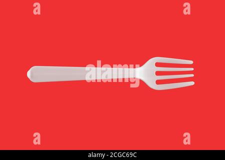 Un tenedor blanco de plástico sobre fondo rojo Foto de stock