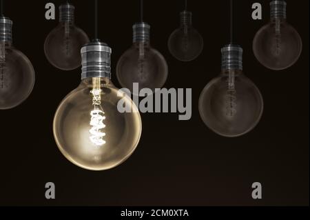 Creatividad innovación luz iluminada fila de bombilla dim unos solución concepto Foto de stock