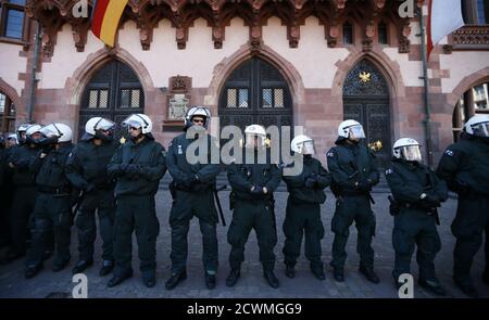 German riot police line up in front of Frankfurt's famous town hall 'Roemer' as they face demonstrators during a protest in Frankfurt, May 17, 2012.    REUTERS/Kai Pfaffenbach (GERMANY - Tags: CIVIL UNREST POLITICS)