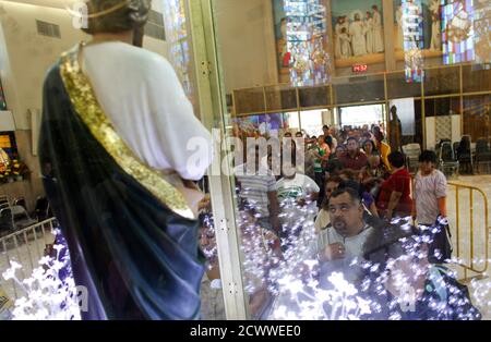 Devotees wait in line to pay respects and ask for favours from San Judas  Tadeo at