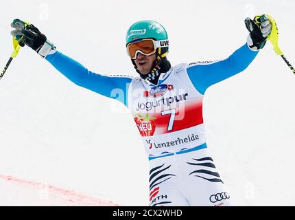 Felix Neureuther of Germany celebrates winning the season's last men's Slalom race at the Alpine Skiing World Cup finals in Lenzerheide March 17, 2013. REUTERS/Denis Balibouse (SWITZERLAND - Tags: SPORT SKIING)