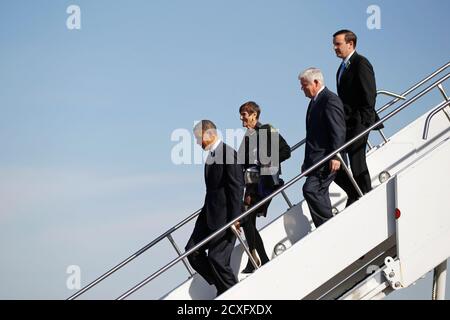 U.S. President Barack Obama steps off Air Force One with (2nd, L-R) Representative Rosa DeLauro, Representative John Larsen and U.S. Senator Chris Murphy (D-CT), at Bradley Air National Guard Base in Hartford, Connecticut, April 8, 2013.  Obama is in Connecticut to deliver remarks on measures to reduce gun violence, at the University of Hartford.  REUTERS/Jason Reed     (UNITED STATES - Tags: POLITICS)