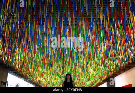 Maestro detergente Asesino Australian artist Nike Savvas inspects her artwork titled 'Rally' that  hangs from the roof of the New South Wales Art Gallery April 7, 2014. Savvas  says her hanging installation, which is made