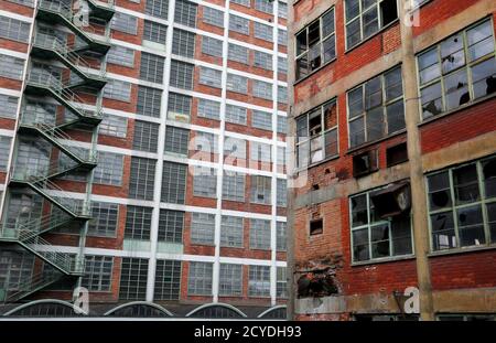 A view shows reconstructed and damaged buildings in an area of Bata's former shoe factory complex in Zlin, October 23, 2012, which Tomas Bata created as part of a 'utopian' factory village for his workers almost a century ago. A world war and four decades of communism has taken some of the shine off Zlin and dozens of the red-brick buildings in its giant factory complex had since fell into disrepair. Now public and private investors are in the final stages of a decade-old plan to restore the area. Picture taken October 23, 2012. REUTERS/Petr Josek (CZECH REPUBLIC - Tags: BUSINESS CONSTRUCTION 
