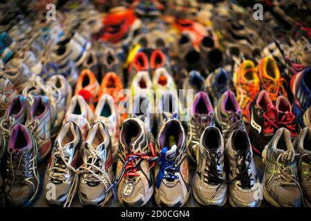 Running shoes left at the makeshift memorial following the 2013 Boston Marathon bombings are displayed in an exhibit titled 'Dear Boston: Messages from the Marathon Memorial' at the Boston Public Library in Boston, Massachusetts April 16, 2014.  The 118th running of the Boston Marathon will be held April 21.   REUTERS/Brian Snyder (UNITED STATES - Tags: SPORT ATHLETICS DISASTER CRIME LAW)