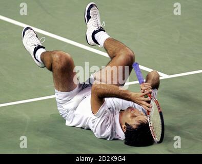 Fabrice Santoro of France reacts to beating David Ferrer of Spain at the Australian Open tennis tournament in Melbourne January 22, 2006. REUTERS/Tim Wimborne