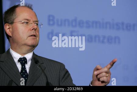 German Finance Minister Peer Steinbrueck makes a point during a news conference in Berlin November 2, 2006. A German government working group of tax experts has agreed on a plan to reduce the tax burden for companies to 29.8 percent from nearly 39 percent from the start of 2008, Steinbrueck said on Thursday. Part of the sentence in the background reads: 'Federal Minister of Finances'.     REUTERS/Tobias Schwarz     (GERMANY)