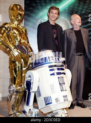 Cast members Hayden Christensen (C) and Ian McDiarmid (R) pose with R2-D2 (L) and C-3PO during a news conference for 'Star Wars: Episode III - Revenge of the Sith' in Tokyo July 6, 2005. The final installment of George Lucus' sci-fi series opens in Japan July 9. REUTERS/Yuriko Nakao  YN/mk