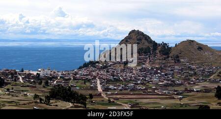 -PHOTO TAKEN 30DEC04- Panoramic view showing the town of Copacabana in Bolivia, some 160 kms northeast of [La Paz], on December 30, 2004. Thousands of pilgrims flock to the Copacabana peninsula at lake Titicaca at the end of every year, at the world's highest lake. Titicaca is navigable to large vessels, lying at 12,500 feet (3,810 m) above sea level in the Andes Mountains of South America, astride the border between [Peru] to the west and Bolivia to the east. Picture taken December 30, 2004.