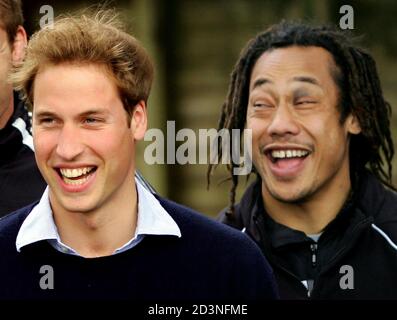 Britain's Prince William (L) laughs with captain of the All Blacks Tana Umaga at a public training session in Auckland July 4, 2005. [Prince William, who graduated recently from Scotland's St Andrews University, met the All Black team two days after they defeated the British and Irish Lions in Wellington and took an unbeatable 2-0 lead in the best-of-three test series.] Prince William is also performing official duties during his ten-day tour of New Zealand, his first official tour of a foreign country by himself.
