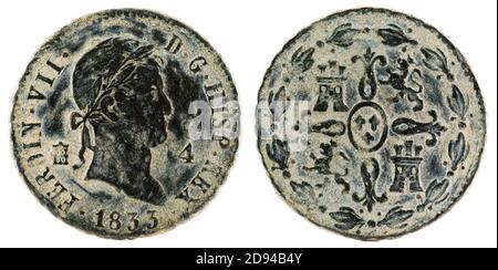 Antigua moneda española de cobre del rey Fernando VII Foto de stock