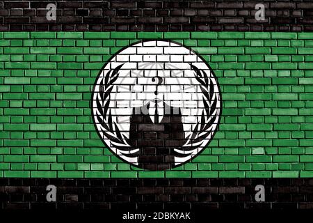 Bandera de Anonymous pintado sobre la pared de ladrillo Foto de stock