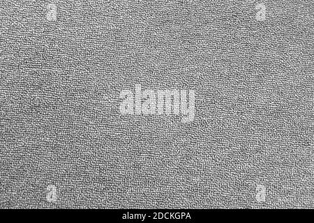 La textura de la alfombra gris. el fondo de tela gris. vista