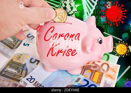 Sparschwein mit 50 Cent Euromünze mit Hand und Corona virus