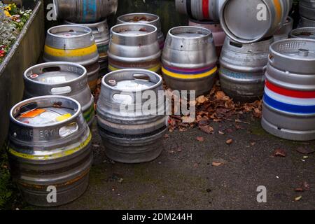 A pile of beer casks barrels in a pub courtyard, December 2020 Stock Photo