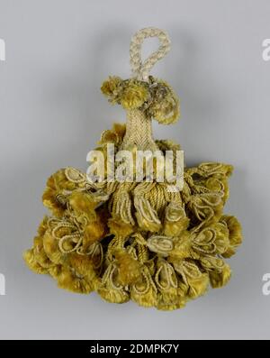 Tassel, Medium: silk, copper wire, linen, wooden core, Skirt of yellow silk threads in two lengths, twisted and looped and holding ornamental tassels. Two collars of similar tassels. Head, cylindrical and broadening toward the base, is wrapped in yellow threads. Loop of white silk threads braided into a cord., Spain, 18th century, trimmings, Tassel Stock Photo