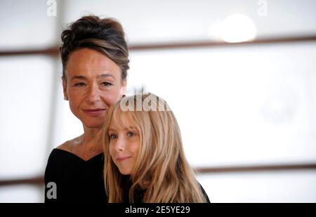 Actresses Dominique Frot (L) and Melusine Mayance pose during a photo call to promote the film 'Elle S'Appelait Sarah' (Sarah's Key) on the final day of the 58th San Sebastian Film Festival September 25, 2010. The French feature film about a U.S. journalist's investigations into the round up of the Jews in Paris during the Second World War is part of the Official Jury Section. REUTERS/Vincent West (SPAIN - Tags: ENTERTAINMENT)