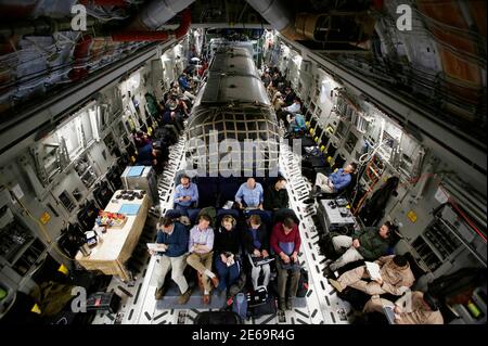 A 'Silver Bullet' airstream trailer (C) carrying U.S. Secretary of Defense Chuck Hagel is pictured inside a U.S. Air Force C-17 aircraft transporting him and his staff from Kabul to Ramstein Airbase in Germany, March 11, 2013. Hagel returned to Washington from his first visit to Afghanistan as Secretary of Defense on Monday.     REUTERS/Jason Reed   (AFGHANISTAN - Tags: MILITARY POLITICS TRANSPORT TPX IMAGES OF THE DAY)