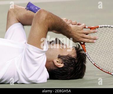 Fabrice Santoro of France reacts to beating David Ferrer of Spain at the Australian Open tennis tournament in Melbourne January 22, 2006. REUTERS/Claro Cortes IV