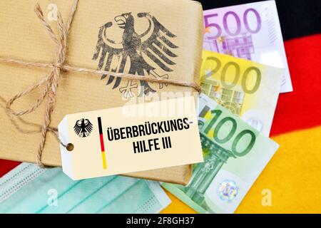 Paquete y billetes en euros en bandera de Alemania, Coronavirus Aid