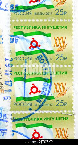 MOSCÚ, RUSIA - 6 DE AGOSTO de 2021: Sellos postales impresos en Rusia dedicados al 25th Aniversario de la República de Ingushetia, serie, alrededor de 2017 Foto de stock