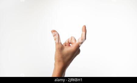 Los dedos de las mujeres muestran una distancia grande sobre un fondo blanco. Fotografía de alta calidad Foto de stock