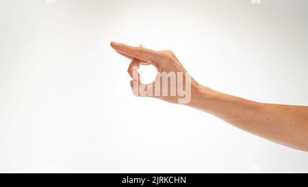 gesto de la mano de la mujer slitban sobre fondo blanco. Fotografía de alta calidad Foto de stock