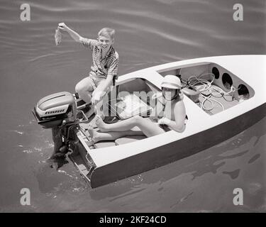 Line of small outboard motor fishing boats at dock at the New