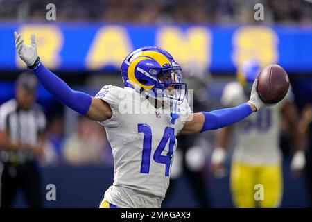 Los Angeles Rams cornerback Cobie Durant (14) leaps over a pile of players  during a preseason NFL football game against the Cincinnati Bengals  Saturday, Aug. 27, 2022, in Cincinnati. (AP Photo/Jeff Dean