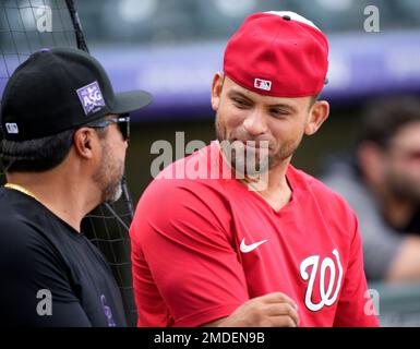 Vinny Castilla, left, special assistant to the general manager of the  Colorado Rockies, greets Chicago Cubs right fielder Carlos Gonzalez before  a baseball game Monday, June 10, 2019, in Denver. Gonzalez was