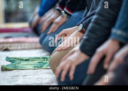 Kosovo Muslim men attend an Eid alFitr prayer marking the end of the