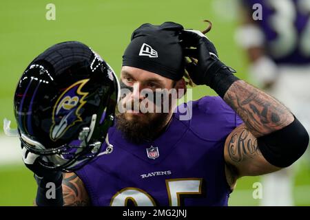 A Cincinnati Bengals helmet sets against the goalpost stanchion that is  wrapped in a banner for Crucial Catch Intercept Cancer before an NFL  football game against the Baltimore Ravens, Sunday, Oct. 9