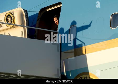 The shadow of President Donald Trump, right, can be seen as Sen. Marco Rubio, R-Fla., left, arrives at Palm Beach International Airport in West Palm Beach, Fla., Friday, Feb. 16, 2018. (AP Photo/Andrew Harnik)