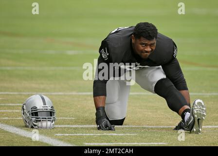 Oakland Raiders defensive end Khalil Mack (52) stretches during the team's  organized team activity at its NFL football training facility Tuesday, June  6, 2017, in Alameda, Calif. (AP Photo/Marcio Jose Sanchez Stock