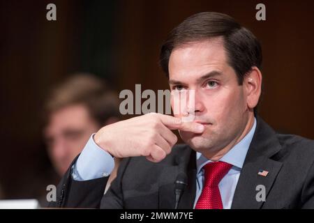 Sen. Marco Rubio, R-Fla. is seen on Capitol Hill in Washington, Thursday, Jan. 12, 2017, prior to introducing Housing and Urban Development Secretary-designate Ben Carson to the Senate Banking, Housing, and Urban Affairs Committee confirmation hearing for Carson. (AP Photo/Zach Gibson)
