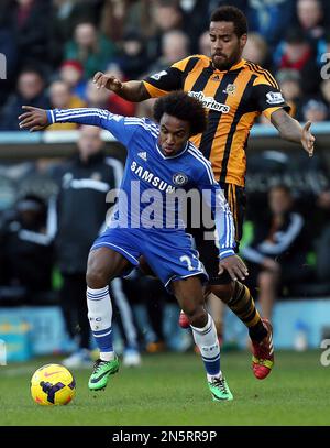 Chelsea's Willian, left, vies for the ball with Derby's Conor Sammon during the English FA Cup third round soccer match between Derby County and Chelsea at the iPro Stadium in Derby, England, Sunday, Jan. 5, 2014. (AP Photo/Kirsty Wigglesworth)